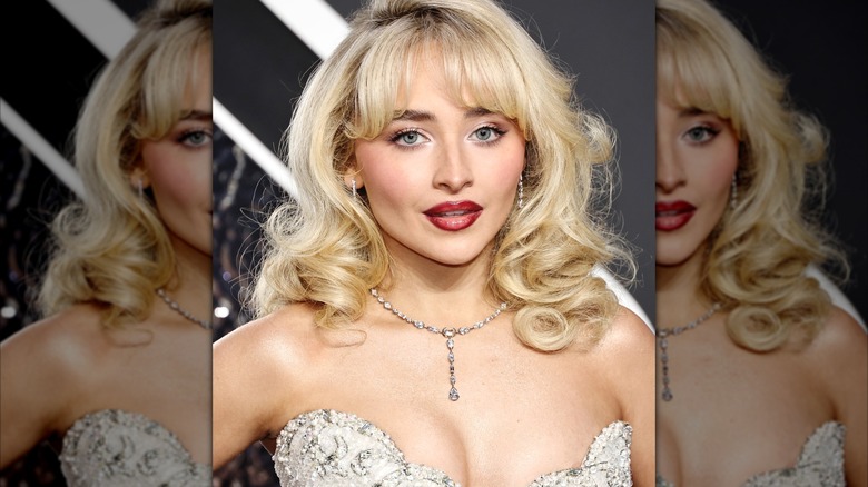 Sabrina Carpenter wearing dark red lipstick at the 2024 VMAs.