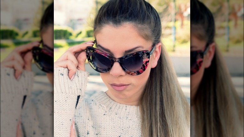 Woman wearing floral-print sunglasses