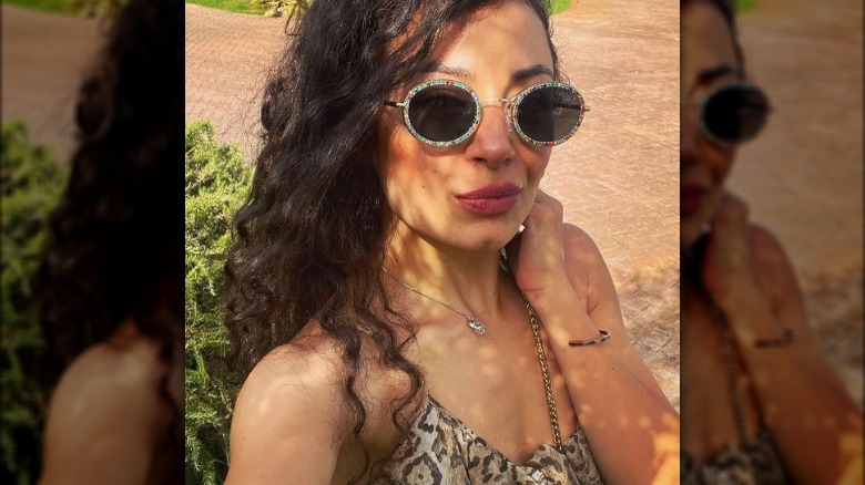 Woman wearing multicolored sunglasses