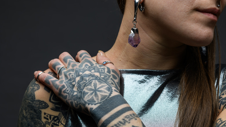 Woman with tribal tattoo on hand