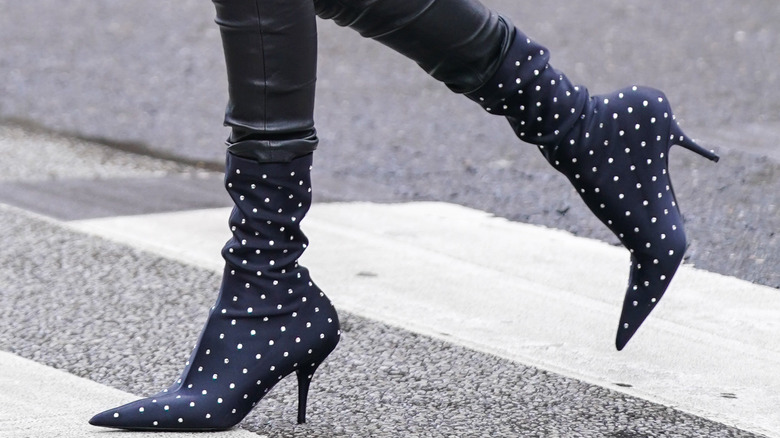 Person wearing polka dotted sock boots