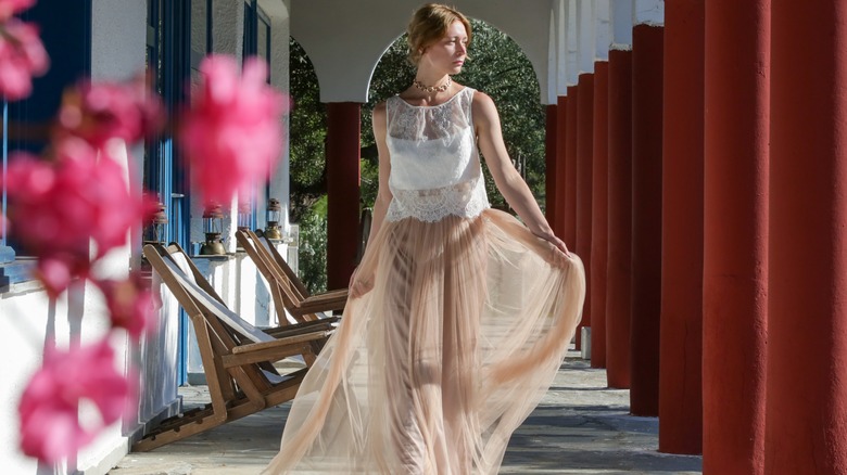 Woman wearing sheer maxi skirt