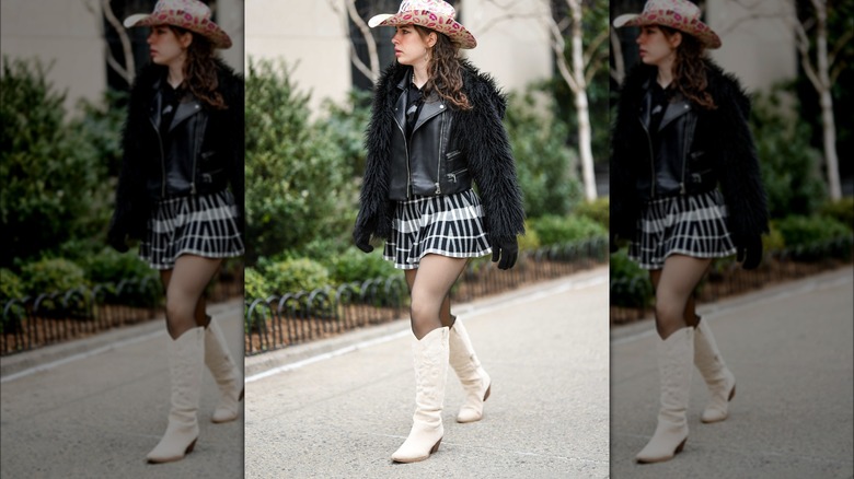 Woman wearing cowboy hat and boots