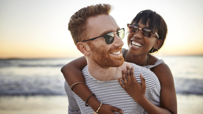 Couple smiling on the beach