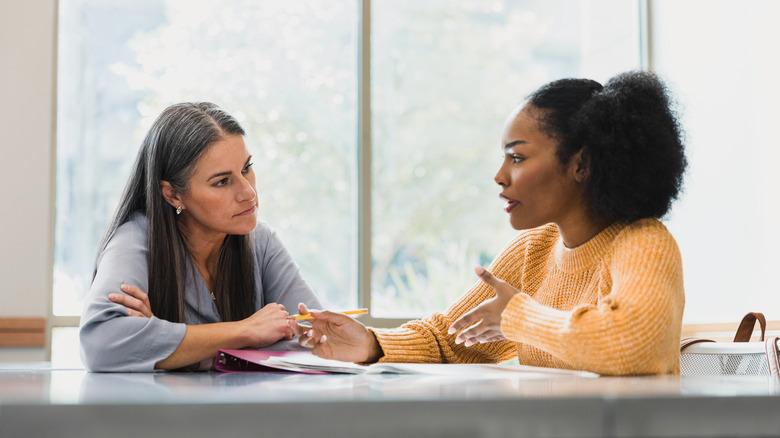 Two women speaking