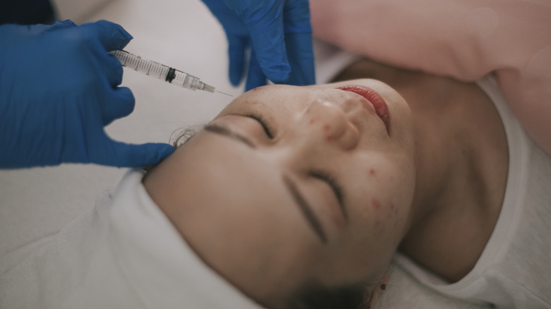 Woman receiving exosome injection