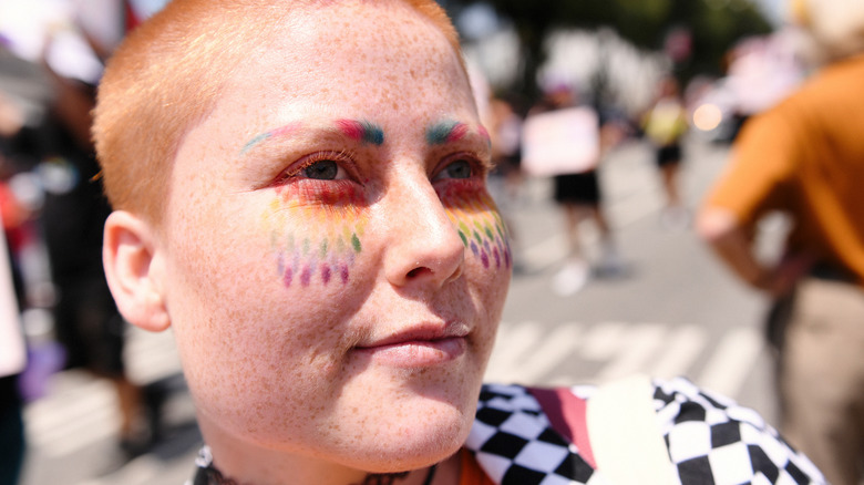 Pride makeup with tinted eyebrows