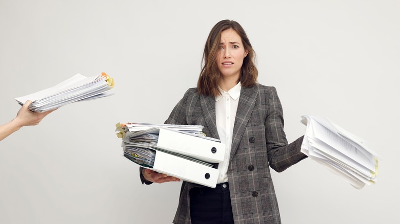 Woman juggling too much work