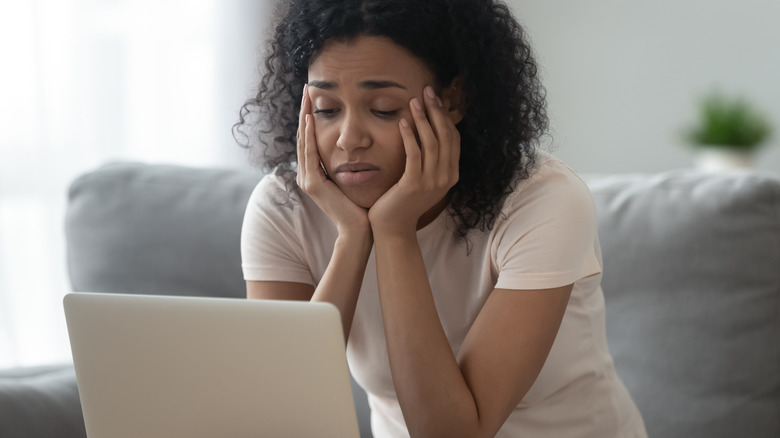 Woman worried on computer