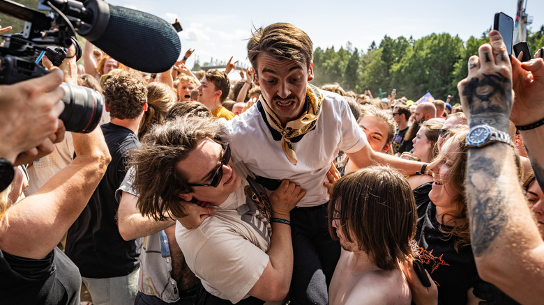 Man lunging through crowd