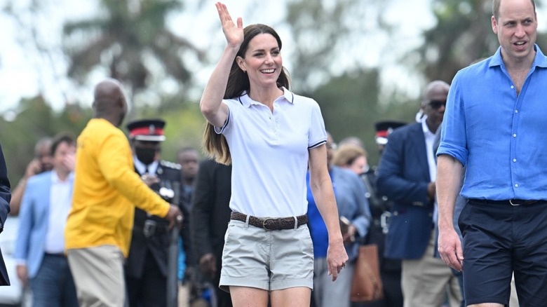 Kate Middleton in white polo shirt, shorts