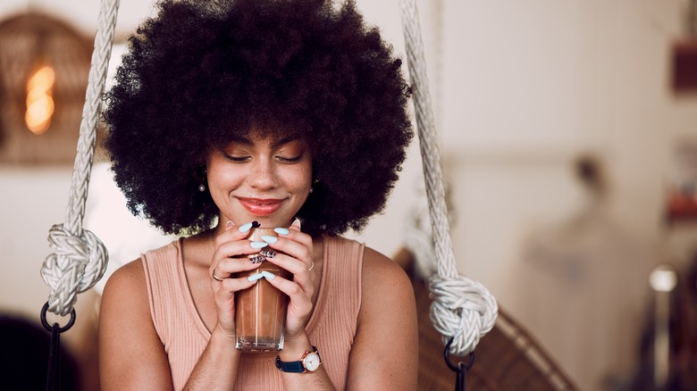 woman alone drinking coffee