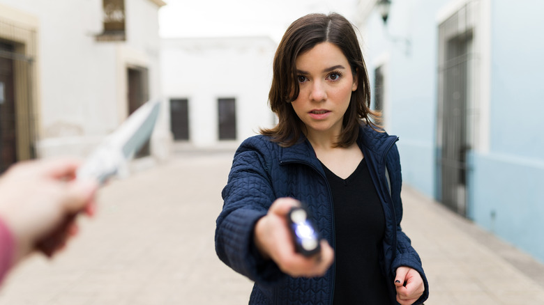 Woman with stun gun