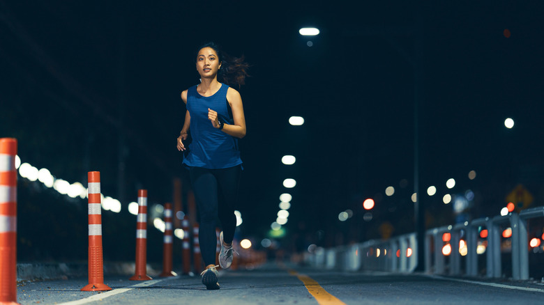 Woman running outdoors on path