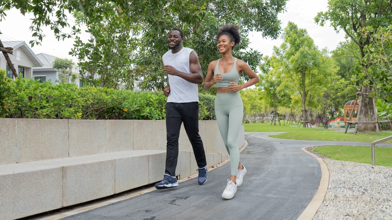 Man and woman jogging outdoors