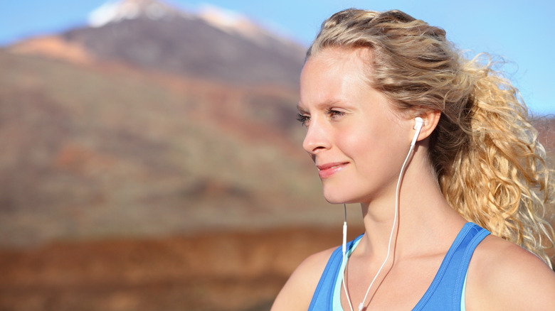 Woman wearing earbuds