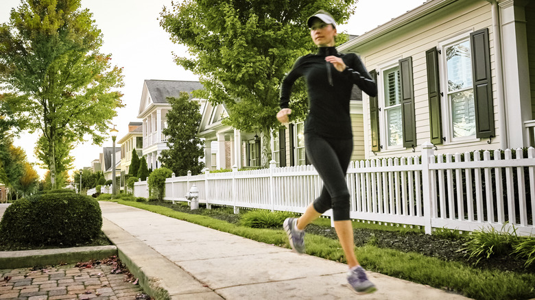 Woman running through neighborhood