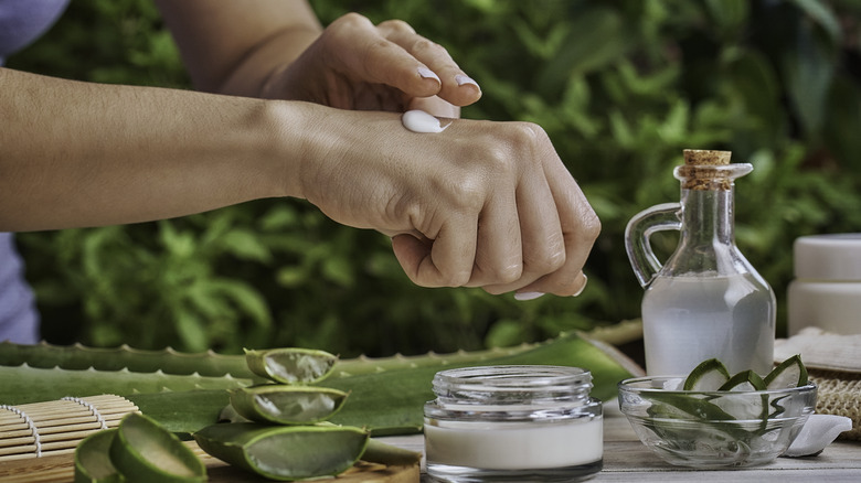 Applying aloe vera products to hands