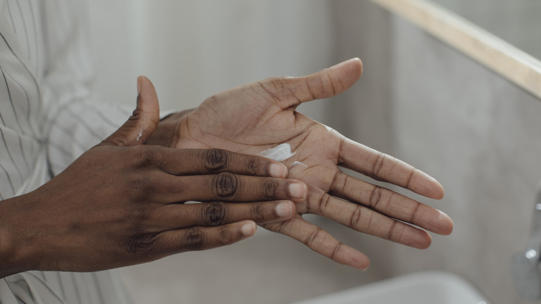 Applying lotion to hands