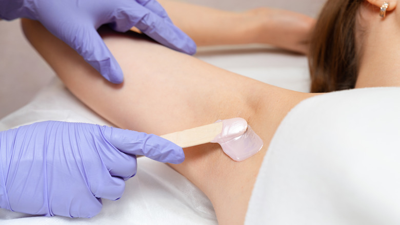 woman waxing underarms 