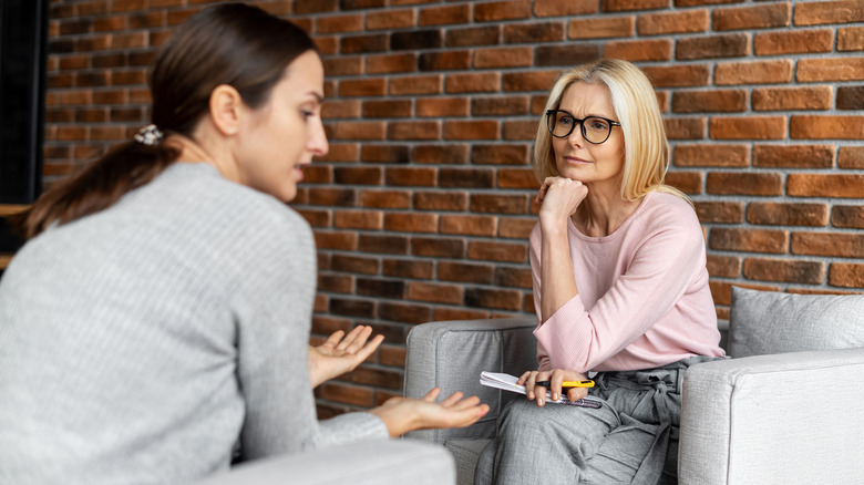 Woman speaking to female therapist