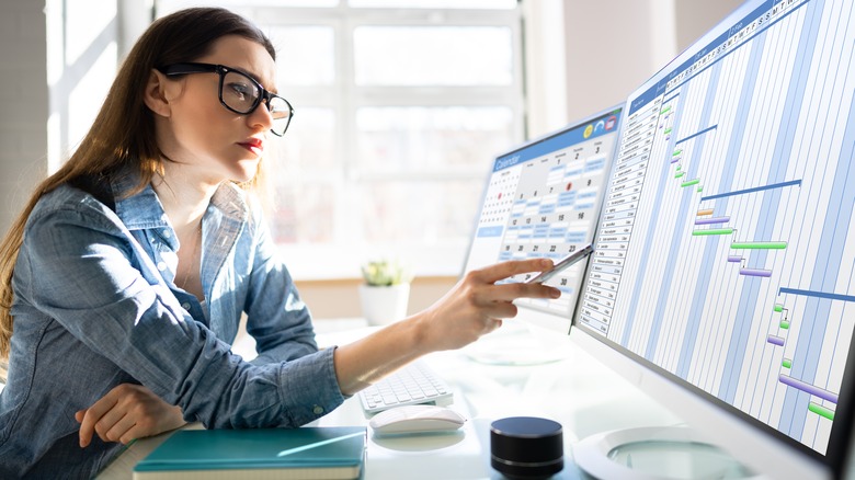 Woman looking at digital calendar