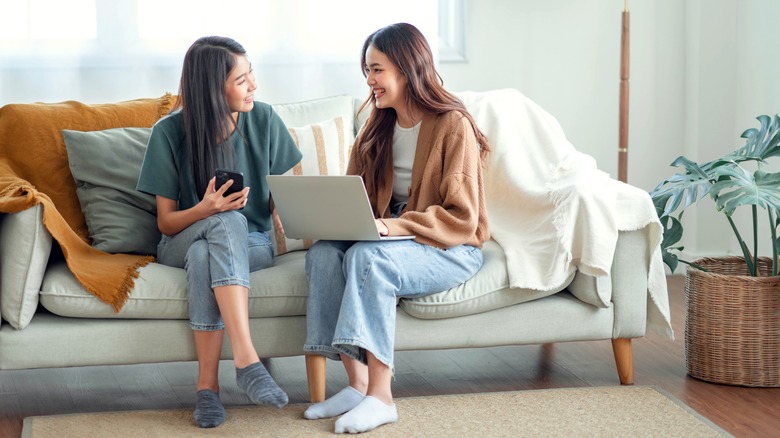 two women on couch 