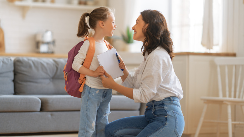 mother and daughter with bag 