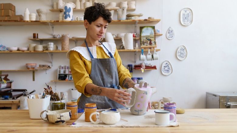 woman admiring homemade jug