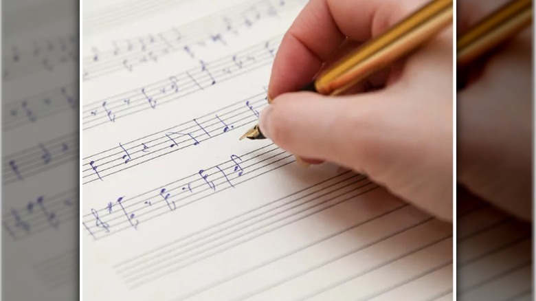 writing music notes on sheet paper