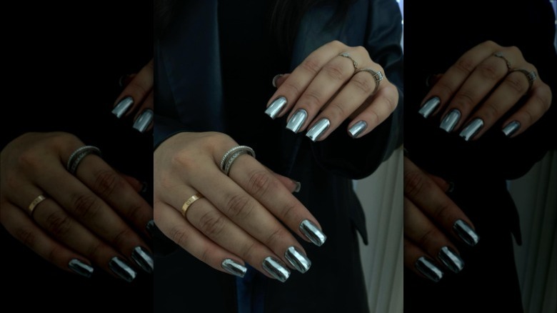 person with silver chrome nails 