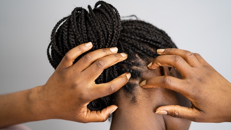 woman scratching itchy scalp