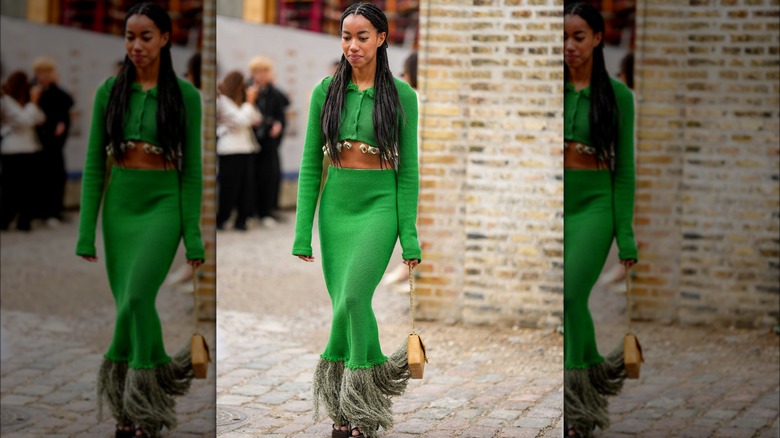 Woman braids green outfit