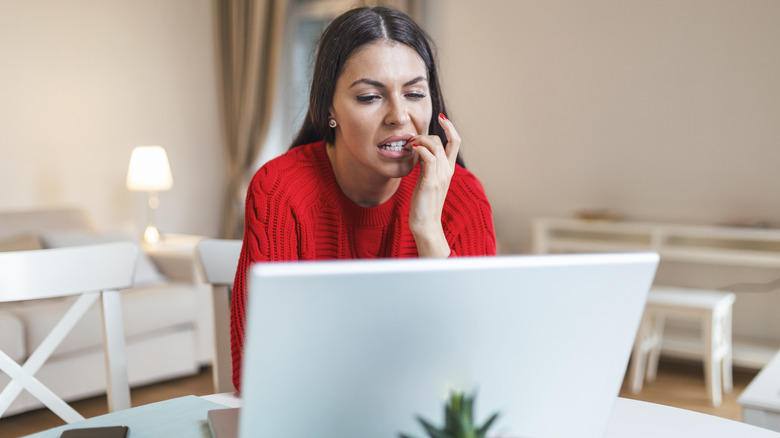 woman biting cuticles