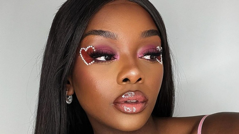 Woman with pink eyeshadow pearl hearts