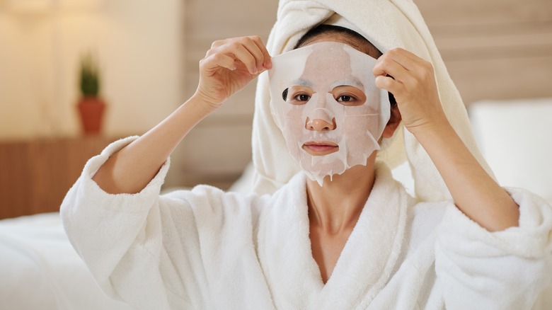 woman applying face mask