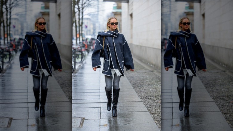 woman wearing Toteme blanket scarf coat