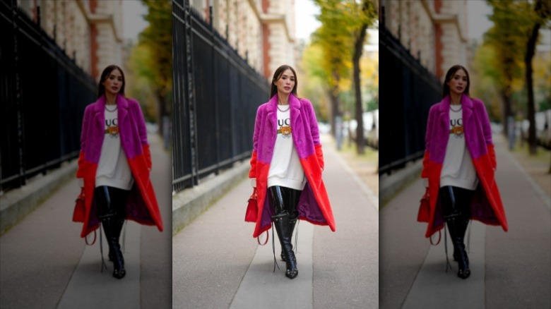 woman wearing long colored fur coat 