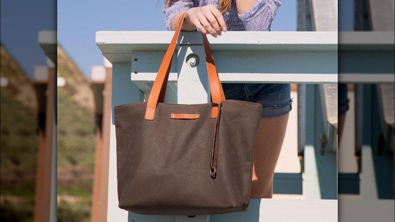 Woman holding canvas tote