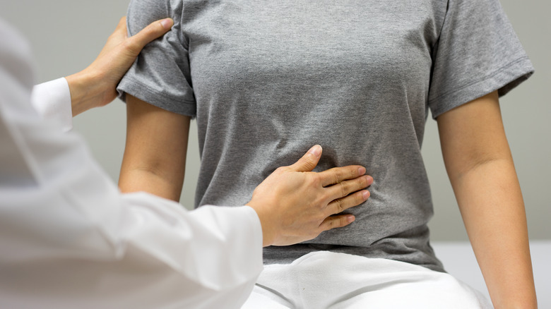 doctors examining patient with uterus