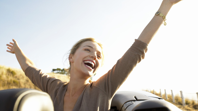 happy woman with stretched arms