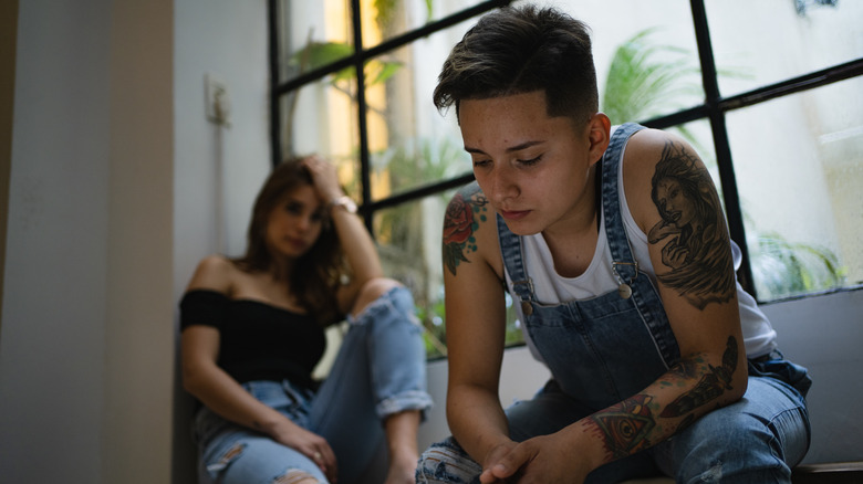 young couple looking tensed