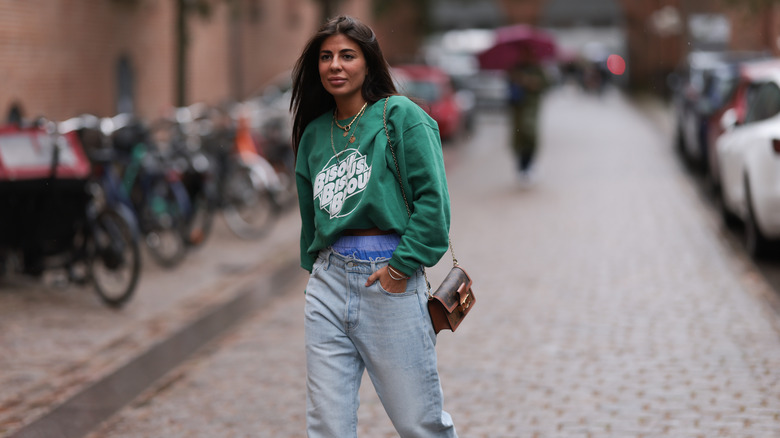 woman with tucked sweater in underwear