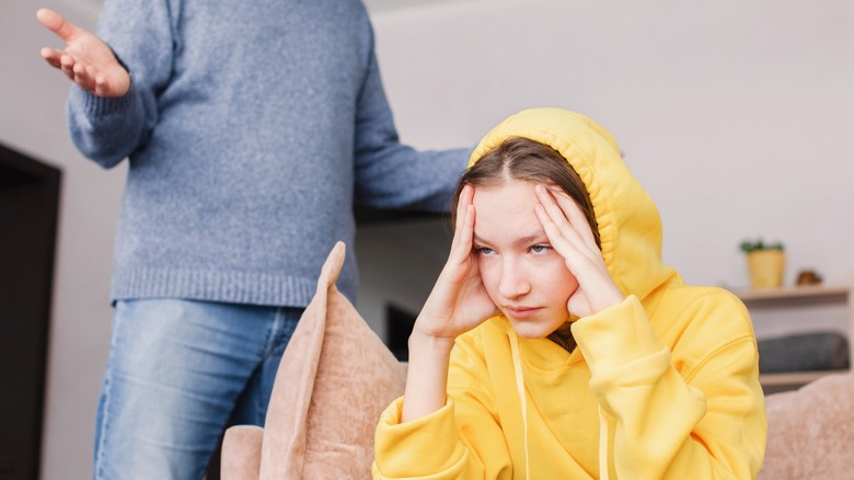 Woman in yellow hoodie