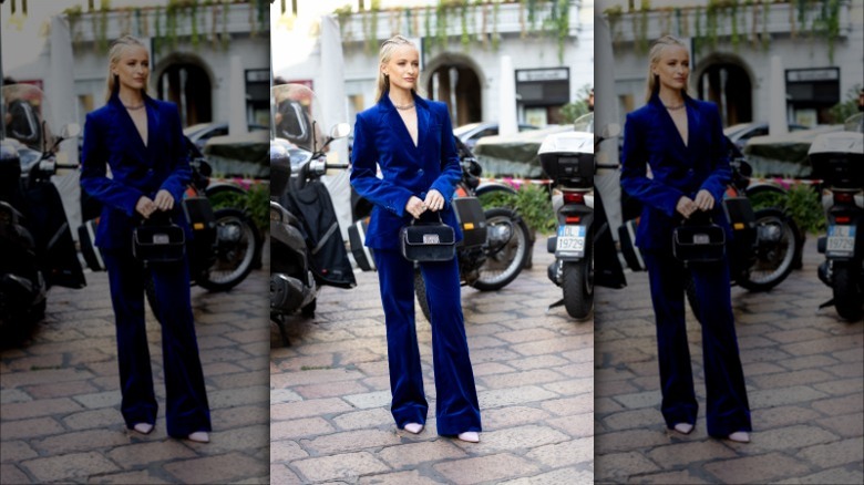 woman wearing electric blue velvet suit