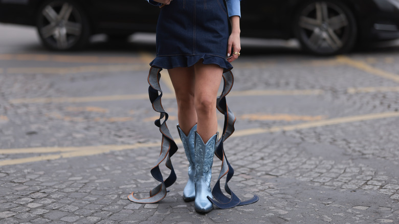 Woman wearing metallic cowboy boots