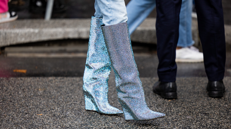 Closeup of sequined wedge boots