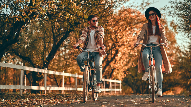 Two people riding bikes