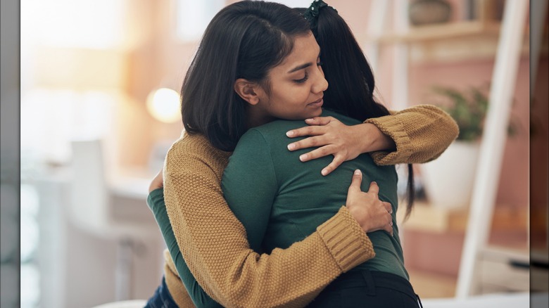 Two people hugging