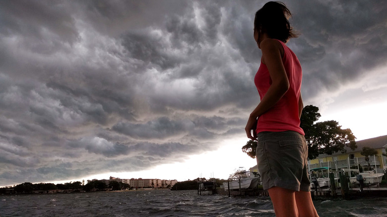 Woman watches severe storm